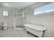 Bathroom featuring a walk-in shower and clawfoot tub at 546 W Lewis Ave, Phoenix, AZ 85003