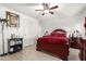 Cozy bedroom with dark wood bed frame at 5984 W Augusta Ave, Glendale, AZ 85301