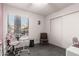 Bright bedroom with window, closet, and seating at 5984 W Augusta Ave, Glendale, AZ 85301