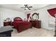 Main bedroom with dark wood furniture at 5984 W Augusta Ave, Glendale, AZ 85301