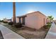 Side view of a tan stucco house with a palm tree at 5984 W Augusta Ave, Glendale, AZ 85301