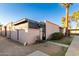 Another view of the tan stucco house and gated entrance at 5984 W Augusta Ave, Glendale, AZ 85301