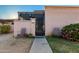 Tan stucco house with a gated entrance and small front yard at 5984 W Augusta Ave, Glendale, AZ 85301