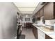 Open kitchen with view to dining area at 5984 W Augusta Ave, Glendale, AZ 85301