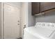 Laundry room with washer, dryer and exterior access at 5984 W Augusta Ave, Glendale, AZ 85301