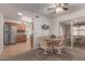 Bright dining area with table and chairs, adjacent to kitchen at 6440 E Dallas St, Mesa, AZ 85205