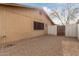 Landscaped backyard with gravel and a gated access at 7202 W Carol Ave, Peoria, AZ 85345