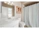 Clean bathroom with shower/tub, vanity, and linen cabinet at 7202 W Carol Ave, Peoria, AZ 85345