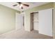 Well-lit bedroom with ceiling fan and mirrored closet at 7202 W Carol Ave, Peoria, AZ 85345