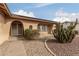 Front entrance features a walkway leading to a double door entry with a security screen at 7202 W Carol Ave, Peoria, AZ 85345