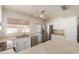 Spacious kitchen with island, stainless steel appliances, and white cabinets at 7202 W Carol Ave, Peoria, AZ 85345