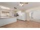 Bright kitchen with white cabinets, stainless steel appliances, and tiled floor at 7202 W Carol Ave, Peoria, AZ 85345