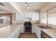 Efficient kitchen with stainless steel appliances and white cabinets at 7202 W Carol Ave, Peoria, AZ 85345