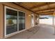 Covered patio with sliding glass door access at 7202 W Carol Ave, Peoria, AZ 85345