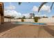 Inviting kidney-shaped pool with a large gravel patio at 7202 W Carol Ave, Peoria, AZ 85345