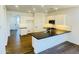Modern kitchen featuring white cabinets, black countertops, and stainless steel appliances at 7802 E Quintana Ave, Mesa, AZ 85212