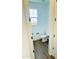 Clean powder room with modern fixtures and wood-look flooring at 7802 E Quintana Ave, Mesa, AZ 85212