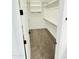 Walk-in closet with custom shelving and plenty of space for storage at 7802 E Quintana Ave, Mesa, AZ 85212