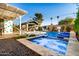 Relaxing backyard with a pool, spa, and patio furniture at 8213 E Mitchell Dr, Scottsdale, AZ 85251