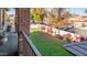Landscaped backyard with lush lawn and bougainvillea at 8280 S Pecan Grove Cir, Tempe, AZ 85284