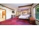 Spacious bedroom with a four-poster bed and access to a bathroom at 8280 S Pecan Grove Cir, Tempe, AZ 85284