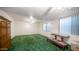Spacious bedroom with green carpet and ample natural light at 8280 S Pecan Grove Cir, Tempe, AZ 85284