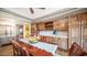 Breakfast nook with wooden table and chairs near kitchen at 8280 S Pecan Grove Cir, Tempe, AZ 85284