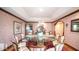 Formal dining room with a round table and floral centerpiece at 8280 S Pecan Grove Cir, Tempe, AZ 85284