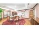 Formal dining room with hardwood floors and large windows at 8280 S Pecan Grove Cir, Tempe, AZ 85284