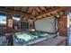Relaxing hot tub situated under a covered patio with brick detailing at 8280 S Pecan Grove Cir, Tempe, AZ 85284