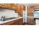 Bright kitchen features wood cabinets, built-in appliances, and ample counter space at 8280 S Pecan Grove Cir, Tempe, AZ 85284
