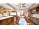 Spacious kitchen with an island, breakfast nook, and stainless steel appliances at 8280 S Pecan Grove Cir, Tempe, AZ 85284