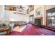 Bright living room featuring high ceilings and a cozy fireplace at 8280 S Pecan Grove Cir, Tempe, AZ 85284