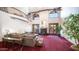 Bright living room featuring high ceilings and a cozy fireplace at 8280 S Pecan Grove Cir, Tempe, AZ 85284