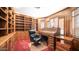 Home office with built-in bookshelves and desk at 8280 S Pecan Grove Cir, Tempe, AZ 85284