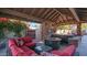 Outdoor patio area with seating, a fireplace, and a hot tub at 8280 S Pecan Grove Cir, Tempe, AZ 85284