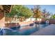 Inviting pool with brick coping and water features at 8280 S Pecan Grove Cir, Tempe, AZ 85284