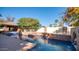 Large pool, brick patio, and covered barbeque area at 8280 S Pecan Grove Cir, Tempe, AZ 85284