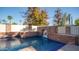 Inviting swimming pool with a brick wall and a lion-head fountain feature at 8280 S Pecan Grove Cir, Tempe, AZ 85284