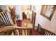 Grand staircase with wooden railings and red carpet runner at 8280 S Pecan Grove Cir, Tempe, AZ 85284