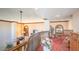 Upstairs hallway with wooden railing, carpeting, and decorative plants at 8280 S Pecan Grove Cir, Tempe, AZ 85284