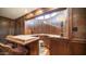 Wet bar with wood cabinets and countertop at 8280 S Pecan Grove Cir, Tempe, AZ 85284