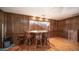 Wet bar with wooden cabinetry, seating, and hardwood floors at 8280 S Pecan Grove Cir, Tempe, AZ 85284