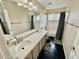 Bathroom with double vanity, bathtub, and shower at 938 W Iris Dr, Gilbert, AZ 85233