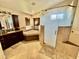 Bathroom features a large soaking tub, walk-in shower, and granite vanity at 938 W Iris Dr, Gilbert, AZ 85233