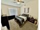Bright bedroom with carpeted floors and large window at 938 W Iris Dr, Gilbert, AZ 85233