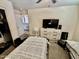 Bedroom with twin beds, dresser and closet at 938 W Iris Dr, Gilbert, AZ 85233