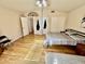 Bedroom with hardwood floors and access to bathroom at 938 W Iris Dr, Gilbert, AZ 85233