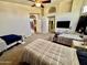 Spacious bedroom with two beds and a ceiling fan at 938 W Iris Dr, Gilbert, AZ 85233