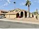 Two-story house with three-car garage and desert landscaping at 938 W Iris Dr, Gilbert, AZ 85233